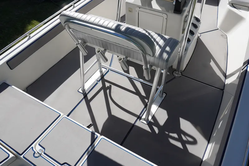 Slide: The Image of 2000 Pathfinder 2200 V boat interior with seating and console, showcasing sleek design. - 6