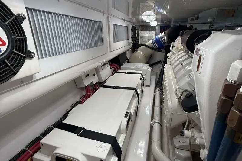 Slide: The Image of Engine room of a 2018 Viking 52 Convertible yacht, showcasing machinery and components. - 22