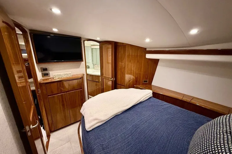 Slide: The Image of Luxurious cabin interior of 2018 Viking 52 Convertible yacht with wood finishes and modern amenities. - 14