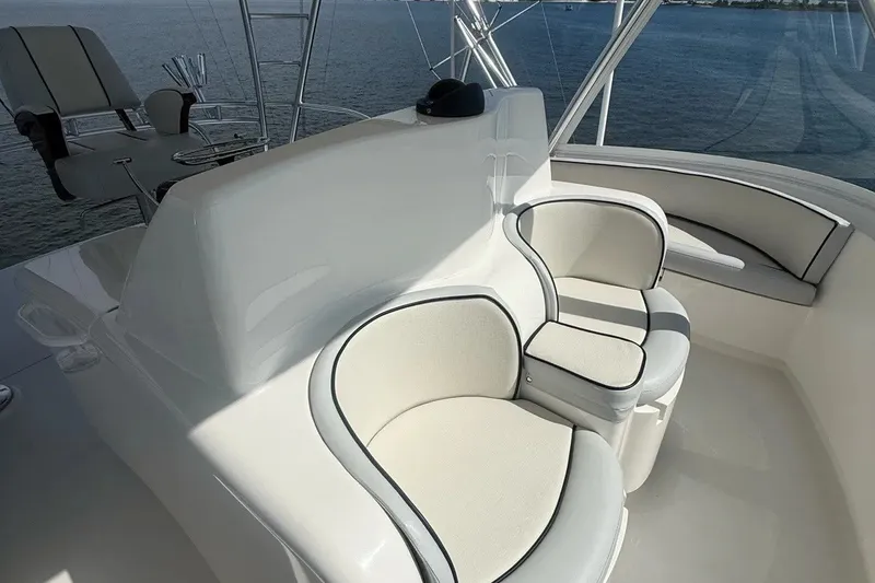 Slide: The Image of Flybridge seating on 2018 Viking 52 Convertible yacht, overlooking the ocean. - 31