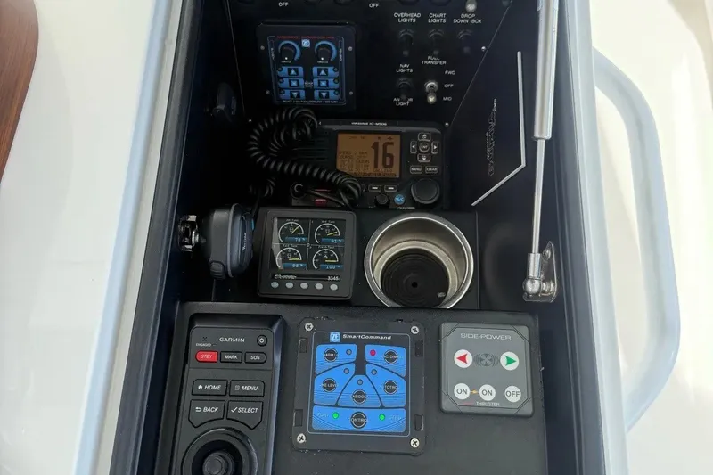 Slide: The Image of Control panel of a 2018 Viking 52 Convertible yacht with navigation and communication equipment. - 29