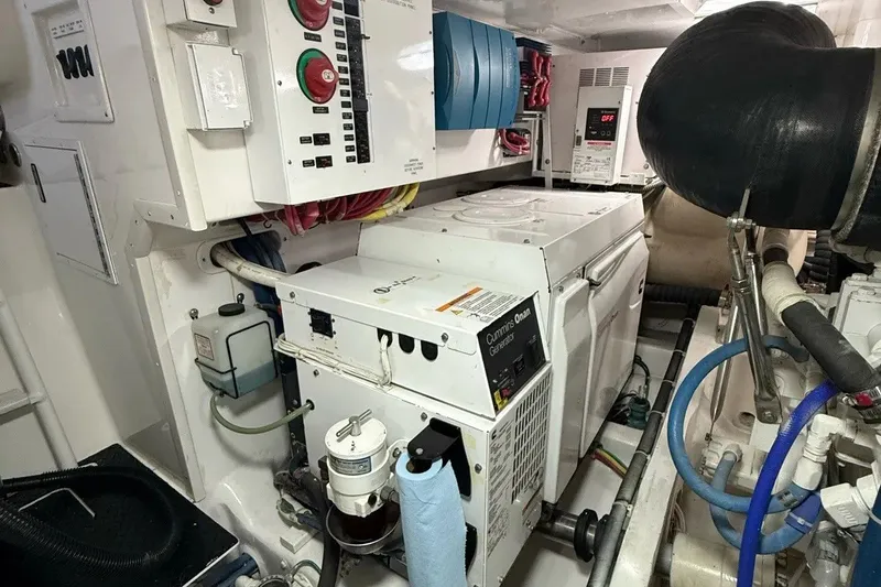 Slide: The Image of Engine room of a 2018 Viking 52 Convertible yacht with Cummins Onan generator. - 25