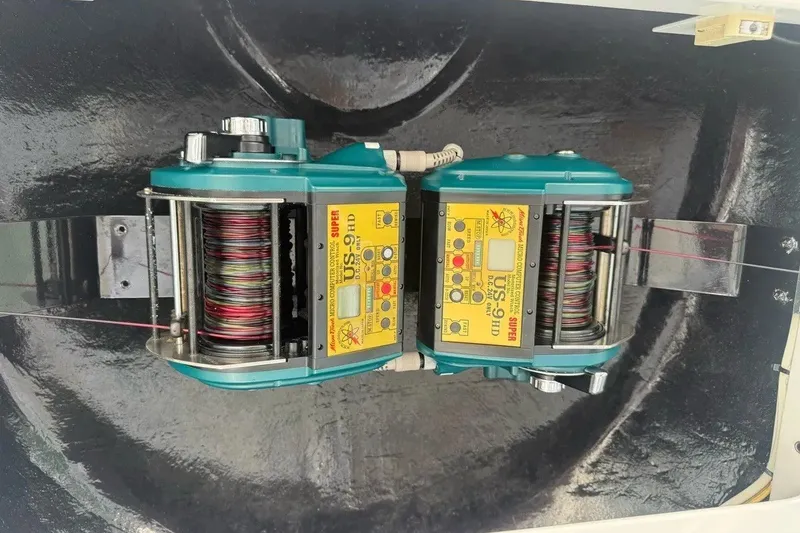 Slide: The Image of Dual electric fishing reels on a 2018 Viking 52 Convertible boat. - 32