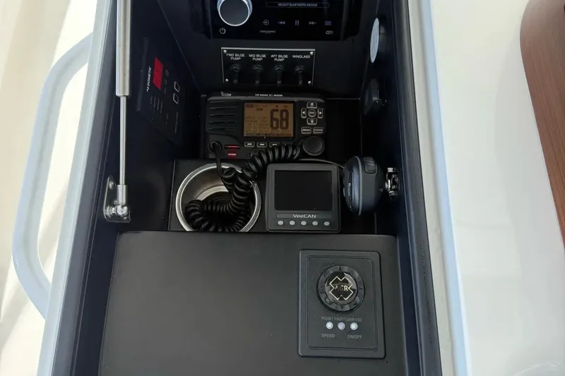 Slide: The Image of Control panel of a 2018 Viking 52 Convertible yacht with communication and navigation equipment. - 28