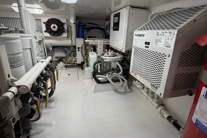 Slide: The Image of Engine room of 2018 Viking 52 Convertible yacht with Dometic equipment and piping system. - 23