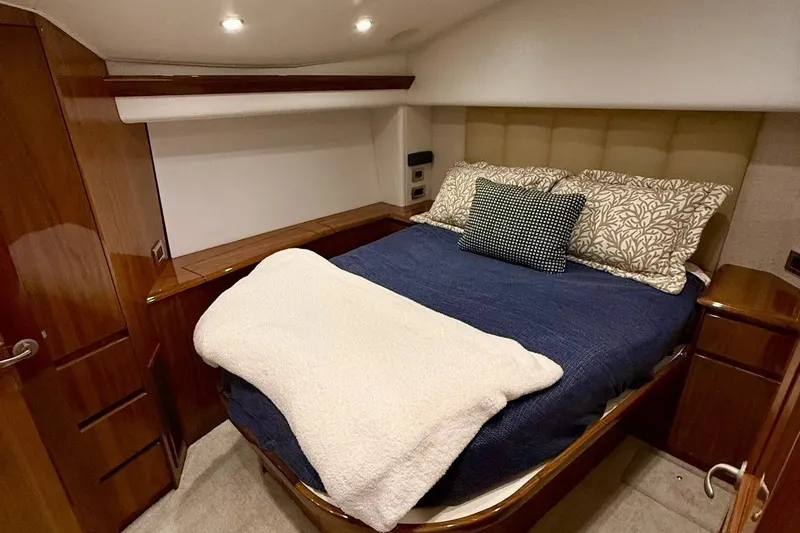 Slide: The Image of Luxurious bedroom interior of 2018 Viking 52 Convertible yacht with cozy bedding. - 13