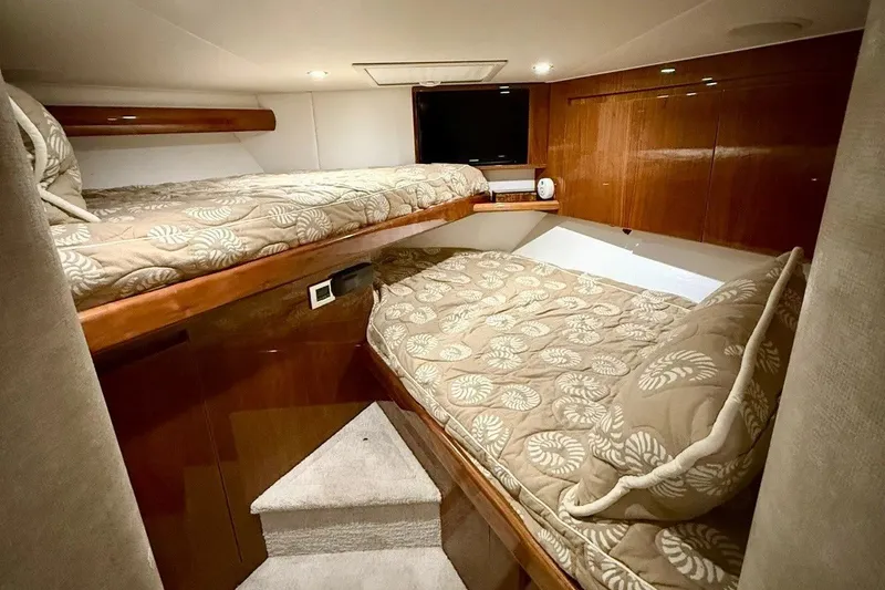 Slide: The Image of Interior cabin of 2018 Viking 52 Convertible yacht with cozy twin beds. - 18