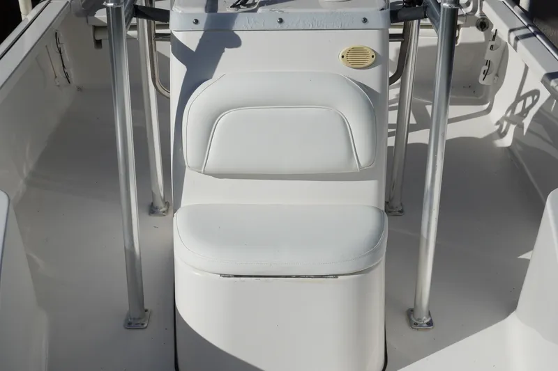 Slide: The Image of 2016 Tidewater 1910 Bay Max boat interior with white seating and metal railings. - 20