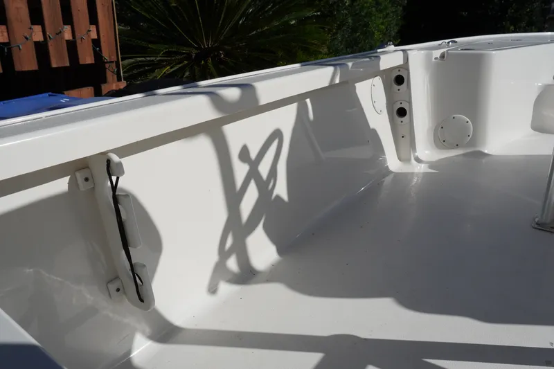 Slide: The Image of 2016 Tidewater 1910 Bay Max boat interior with clean white deck and side panel. - 13