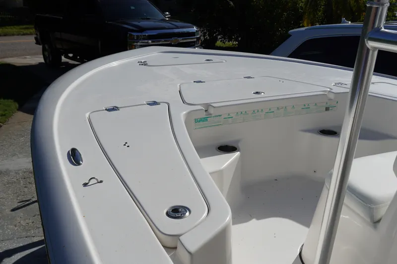 Slide: The Image of 2016 Tidewater 1910 Bay Max boat deck with storage compartments and seating. - 15
