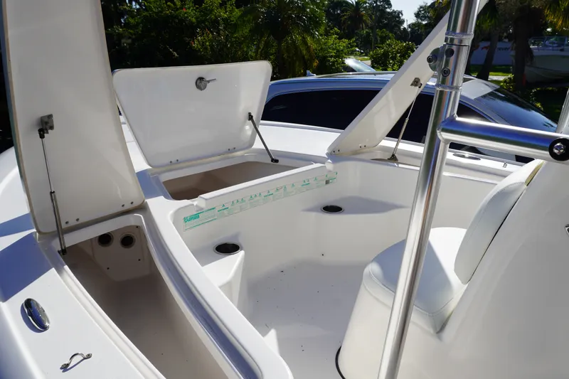 Slide: The Image of 2016 Tidewater 1910 Bay Max boat interior with open storage compartments. - 16