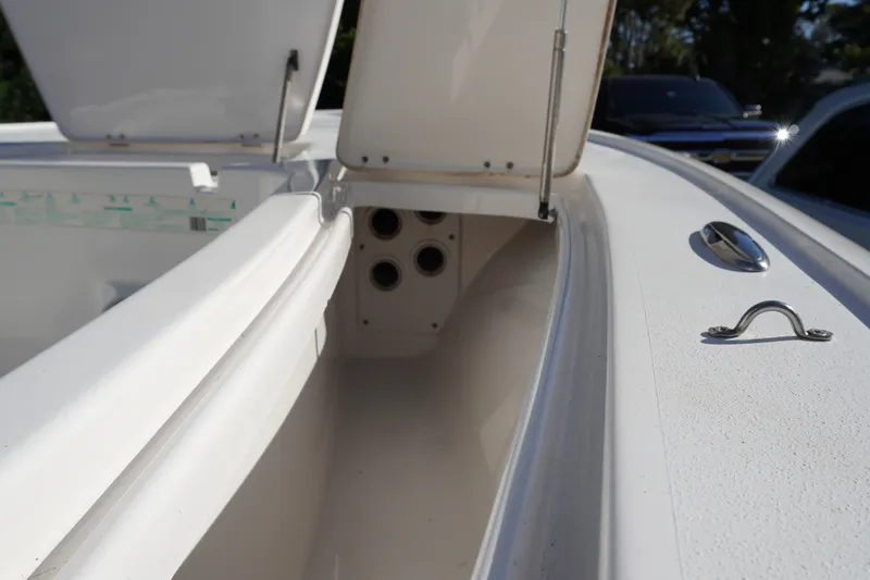 Slide: The Image of 2016 Tidewater 1910 Bay Max boat interior with open storage compartments. - 18