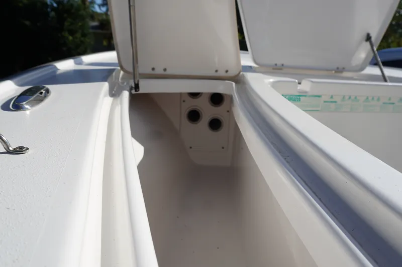 Slide: The Image of 2016 Tidewater 1910 Bay Max boat interior storage compartment with open hatch. - 17