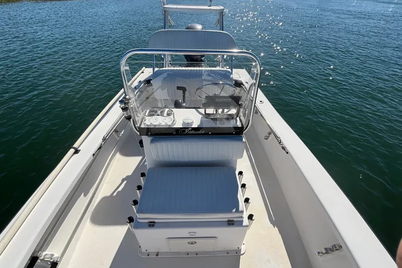 Slide: The Image of 2008 Intruder 198 boat on water, featuring a central console and seating. - 10