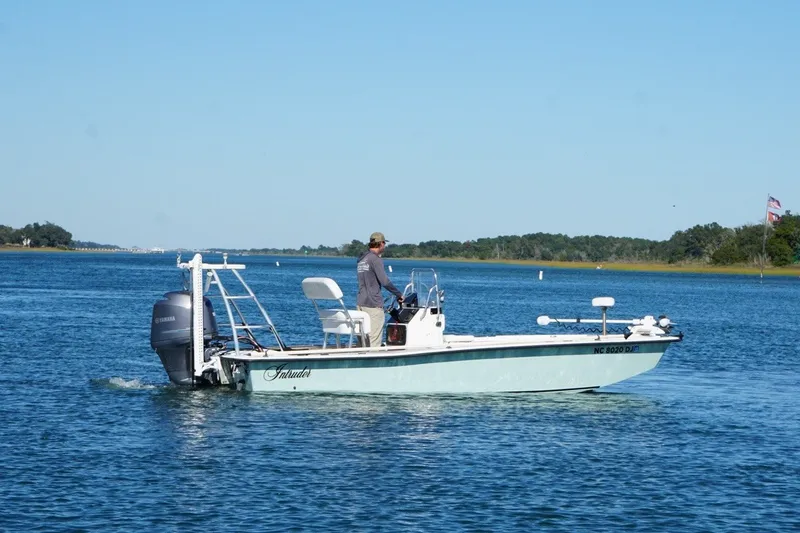 The Image of Boat on water, 2008 Intruder 198 model, with Yamaha engine, cruising under clear blue sky. - 1