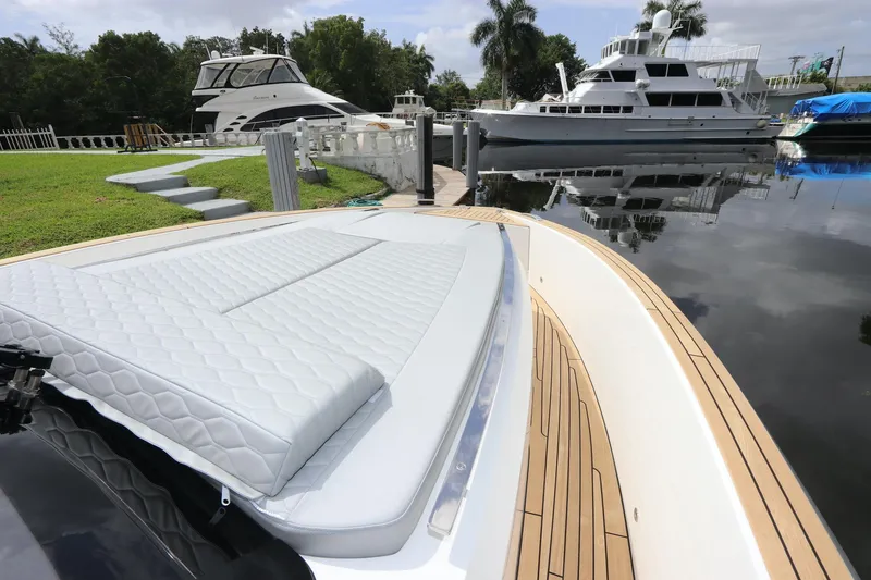 Slide: The Image of 2024 Astondoa 377 Coupe Outboard docked, featuring sleek design and luxurious deck. - 17