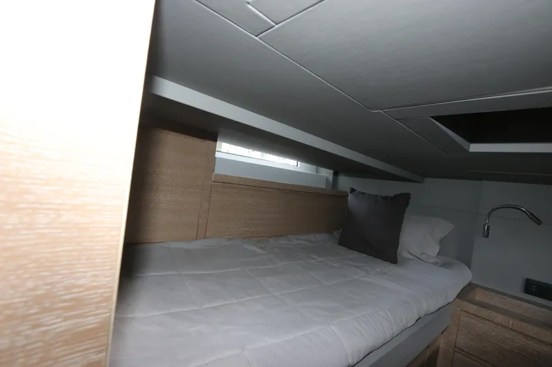 Slide: The Image of 2024 Astondoa 377 Coupe Outboard cabin interior with bed and modern design. - 43