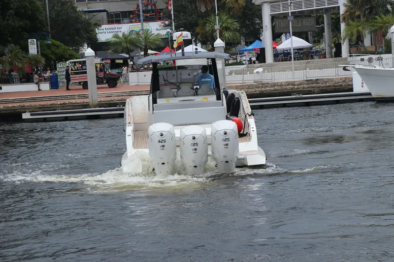 Slide: The Image of 2024 Astondoa 377 Coupe Outboard cruising in a marina. - 7
