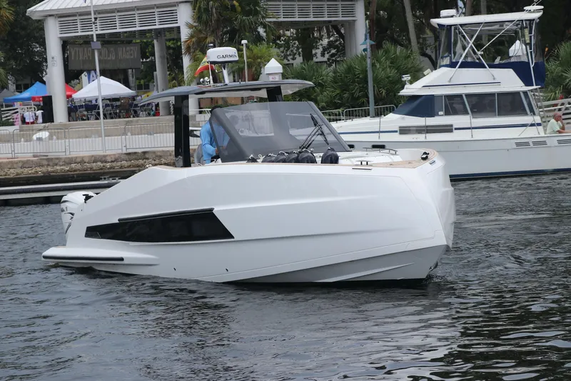 Slide: The Image of 2024 Astondoa 377 Coupe Outboard boat on water, sleek design, modern features. - 3