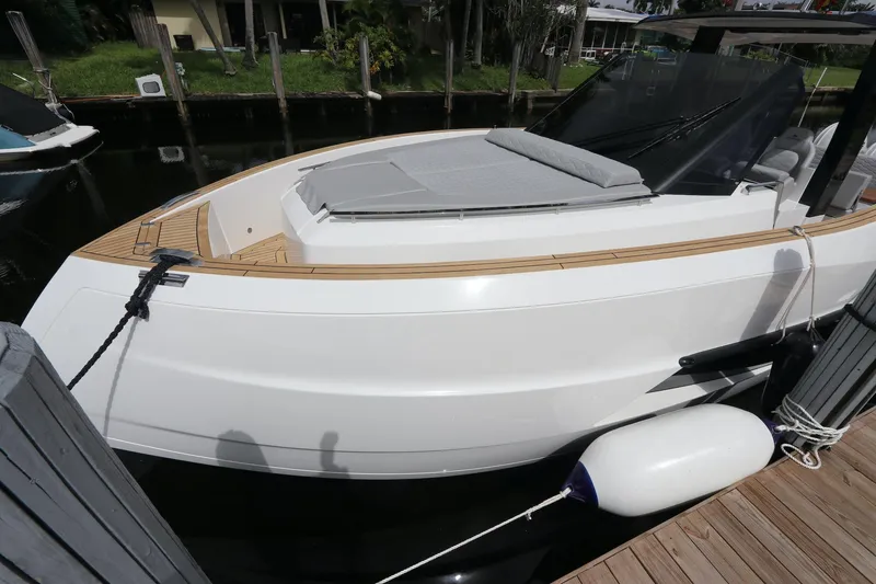 Slide: The Image of 2024 Astondoa 377 Coupe Outboard docked, showcasing sleek design and modern features. - 10