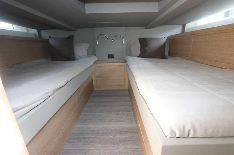Slide: The Image of 2024 Astondoa 377 Coupe Outboard cabin with twin beds and modern design. - 41