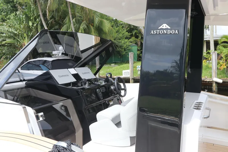 Slide: The Image of 2024 Astondoa 377 Coupe Outboard yacht cockpit with sleek design and modern controls. - 19