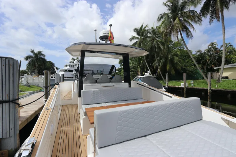 Slide: The Image of 2024 Astondoa 377 Coupe Outboard yacht with sleek deck and luxurious seating. - 27