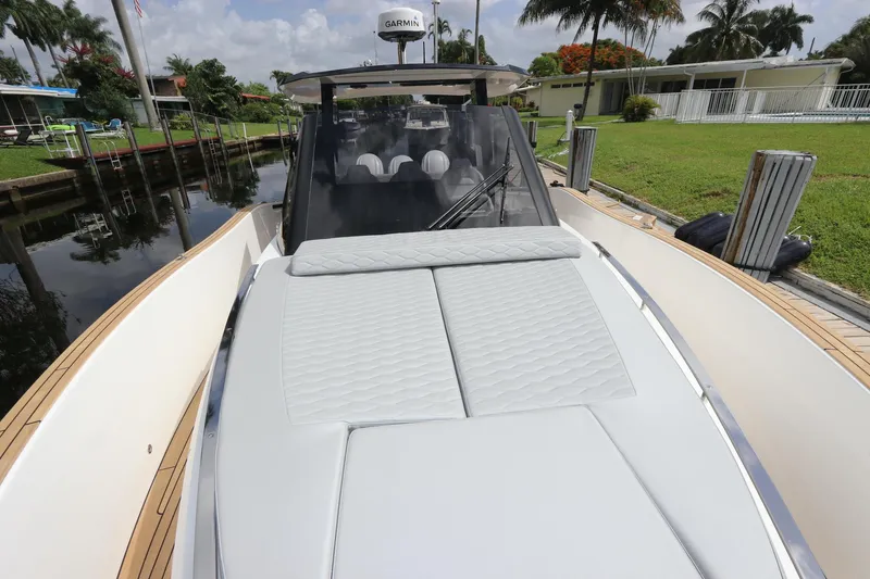 Slide: The Image of 2024 Astondoa 377 Coupe Outboard with sleek deck design and luxurious seating. - 15