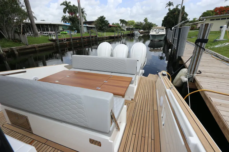 Slide: The Image of 2024 Astondoa 377 Coupe Outboard, luxury yacht with spacious deck and seating area. - 29