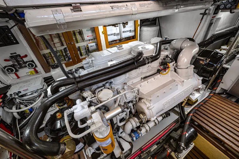 Slide: The Image of Engine room of 2002 Grand Banks 46 Classic yacht, showcasing detailed machinery and components. - 30