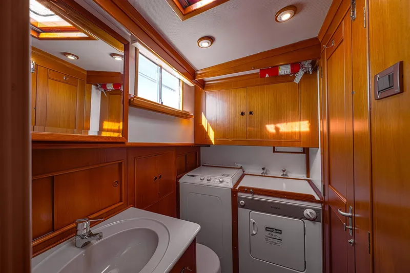 Slide: The Image of Laundry area with washer and dryer in 2002 Grand Banks 46 Classic yacht. - 15