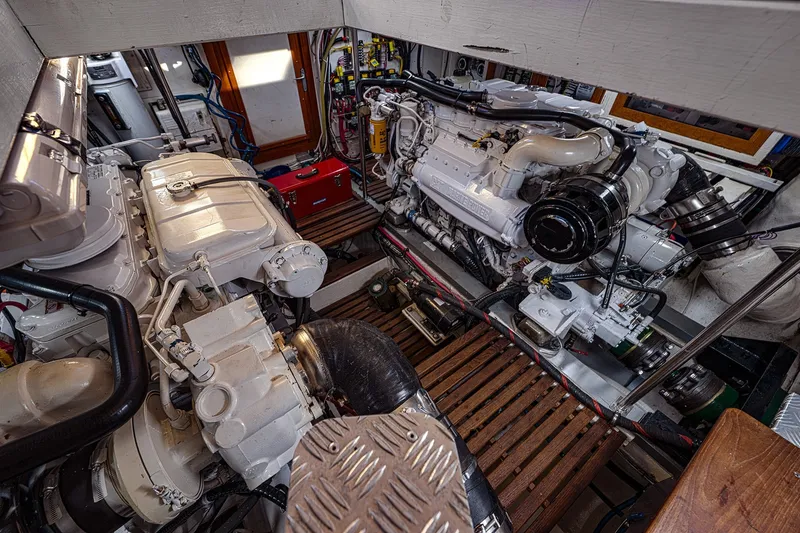 Slide: The Image of Engine room of 2002 Grand Banks 46 Classic yacht, showcasing dual engines and mechanical components. - 32