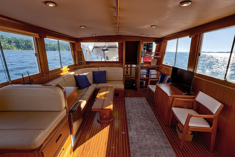 Slide: The Image of Interior of 2002 Grand Banks 46 Classic yacht with elegant wood finish and comfortable seating. - 23