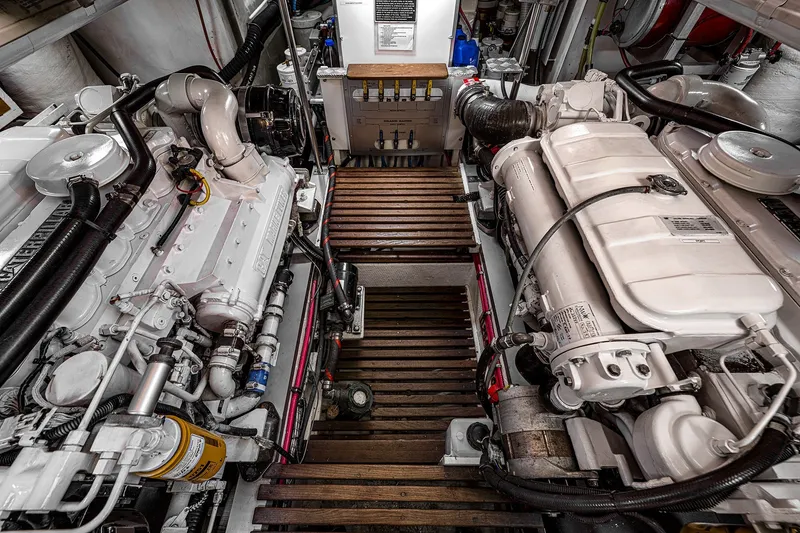 Slide: The Image of Engine room of 2002 Grand Banks 46 Classic yacht, featuring dual engines and wooden flooring. - 29
