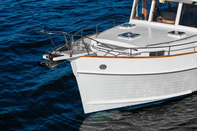 Slide: The Image of Grand Banks 46 Classic yacht, 2002 model, cruising on deep blue ocean waters. - 6