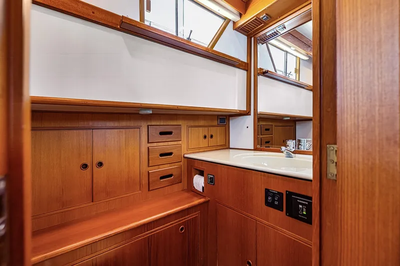 Slide: The Image of Luxurious wooden bathroom interior on 2002 Grand Banks 46 Classic yacht. - 9