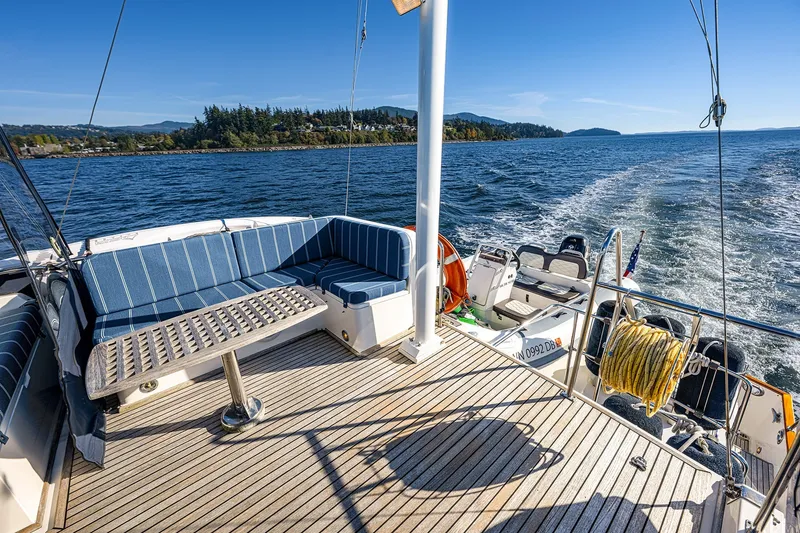 Slide: The Image of Grand Banks 46 Classic yacht deck with seating, cruising on a sunny day, 2002 model. - 28