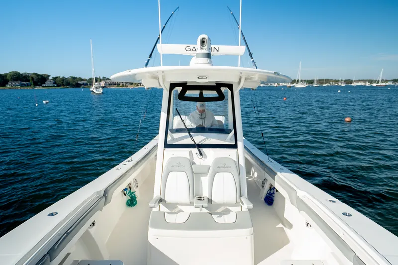 Slide: The Image of A 2022 Regulator 34 CC on calm water with a clear view of the cockpit. - 18