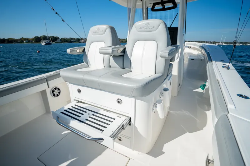 Slide: The Image of The image shows the cockpit of a 2022 Regulator 34 CC boat with luxurious seating. - 30