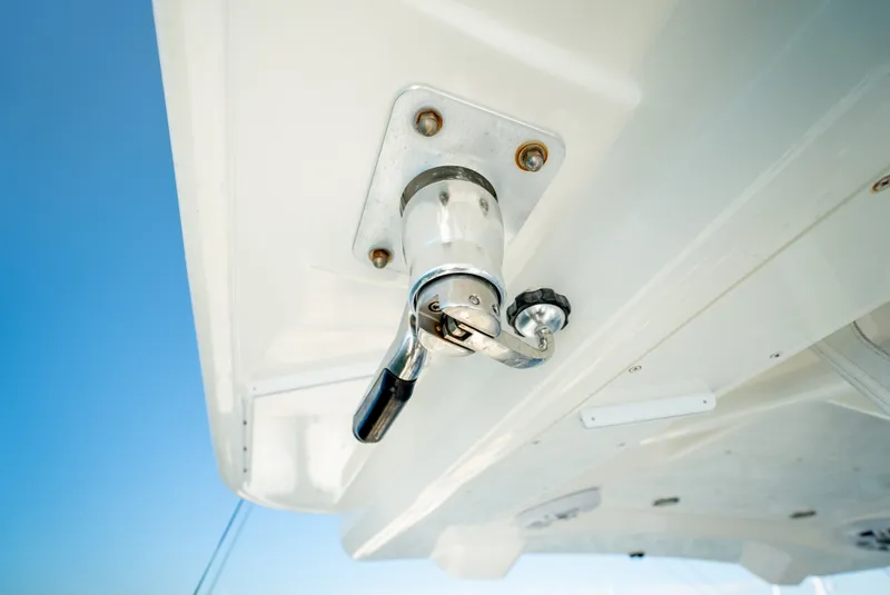 Slide: The Image of Close-up of a boat part with a metal handle and blue sky in the background. - 23