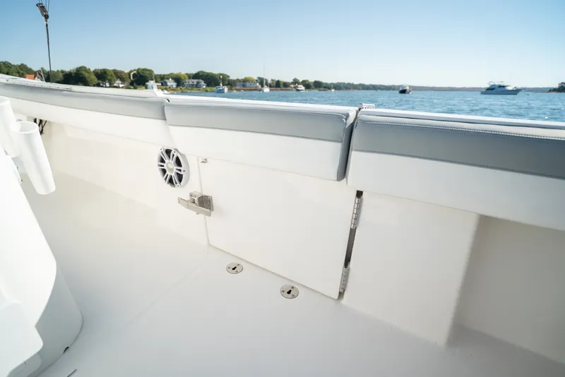 Slide: The Image of The image shows the deck of a 2022 Regulator 34 CC boat with a view of the water. - 32