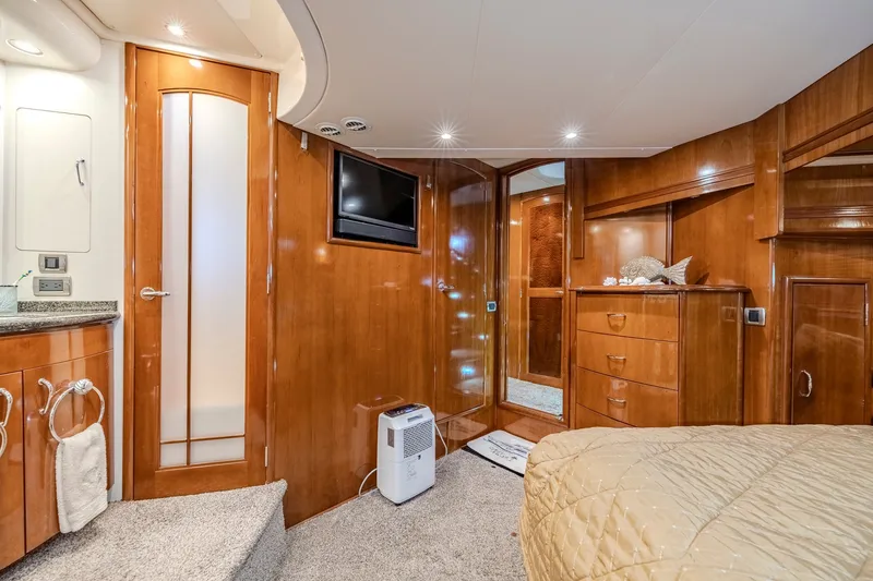 Slide: The Image of Luxurious interior of 2006 Carver 56 Voyager yacht with wood finishes and modern amenities. - 56