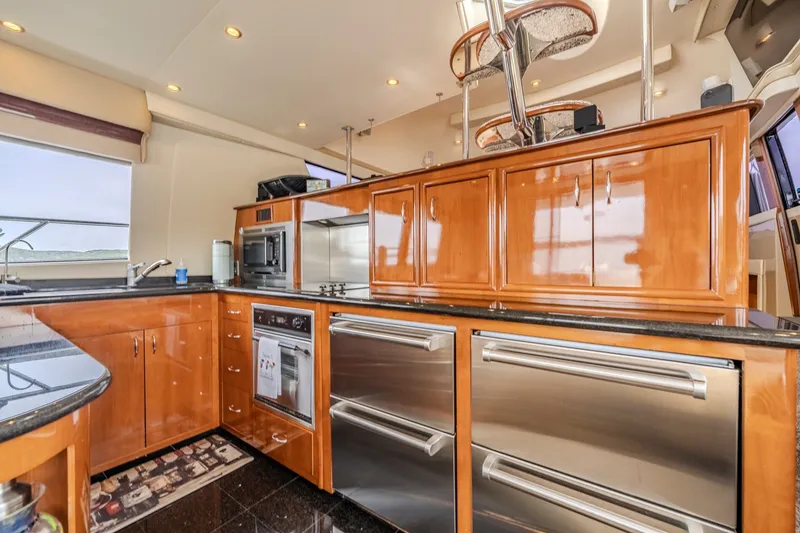 Slide: The Image of Luxurious kitchen interior of a 2006 Carver 56 Voyager yacht with modern appliances. - 37