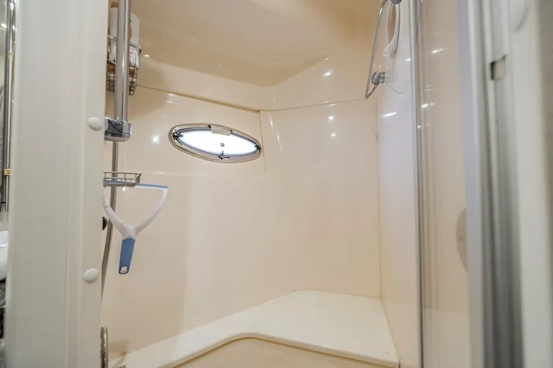 Slide: The Image of Shower area in 2006 Carver 56 Voyager yacht with porthole window. - 66