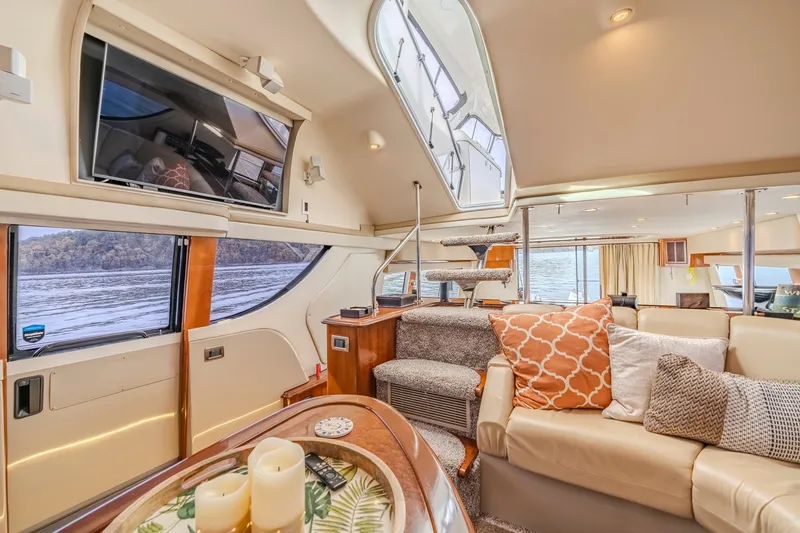 Slide: The Image of Luxurious interior of a 2006 Carver 56 Voyager yacht with elegant seating and scenic views. - 43