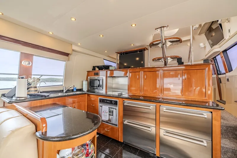 Slide: The Image of Luxurious kitchen interior of 2006 Carver 56 Voyager yacht with modern appliances and sleek design. - 36