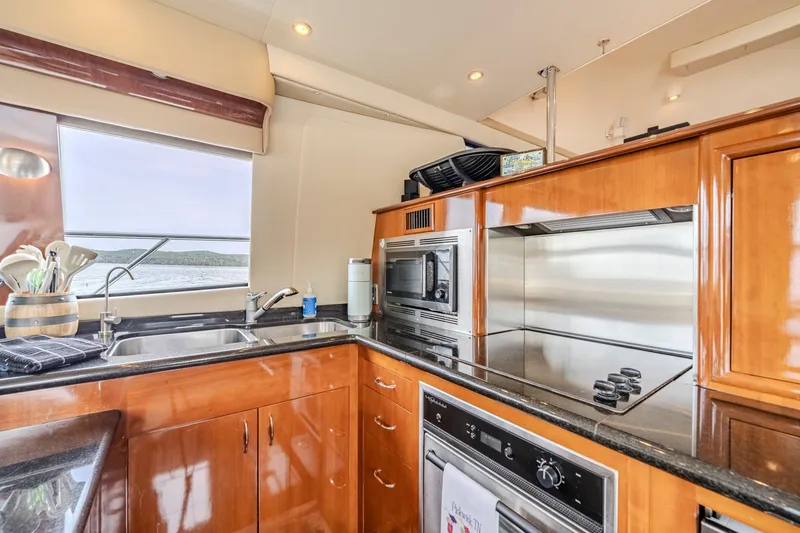 Slide: The Image of Luxurious kitchen interior of 2006 Carver 56 Voyager yacht with modern appliances. - 38