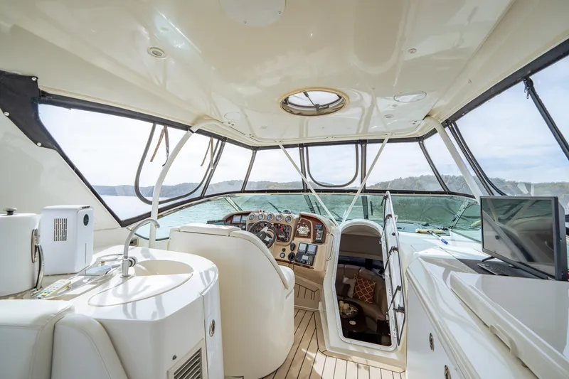 Slide: The Image of Interior of 2006 Carver 56 Voyager yacht with helm, sink, and TV. - 48