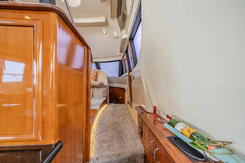 Slide: The Image of Luxurious interior of 2006 Carver 56 Voyager yacht with elegant wood finishes and plush seating. - 41