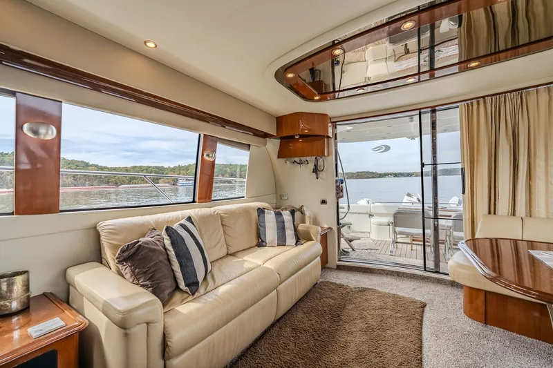 Slide: The Image of Luxurious interior of 2006 Carver 56 Voyager yacht with plush seating and scenic views. - 34